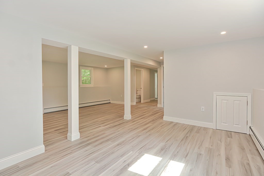31 Clarkson Drive Walpole, MA 02081 - Photo 25 of 36 wooden floor in an empty room with a window