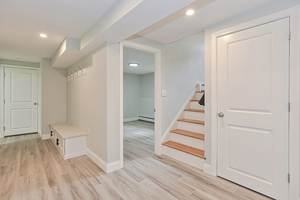 31 Clarkson Drive Walpole, MA 02081 - Photo 26 of 36 a view of a hallway with wooden floor and entryway