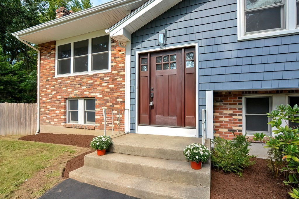 31 Clarkson Drive Walpole, MA 02081 - Photo 3 of 36 a front view of a house having yard