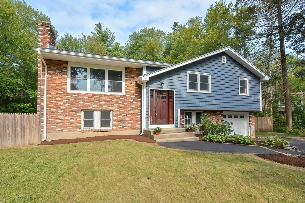 31 Clarkson Drive Walpole, MA 02081 - Photo 36 of 36 a front view of a house with a garden