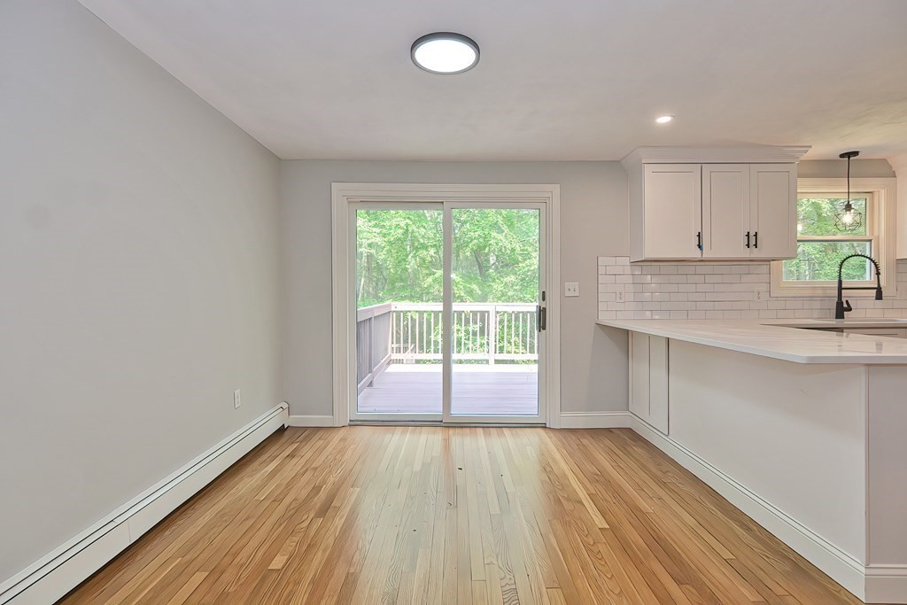 31 Clarkson Drive Walpole, MA 02081 - Photo 8 of 36 a view of a room with wooden floor and fan