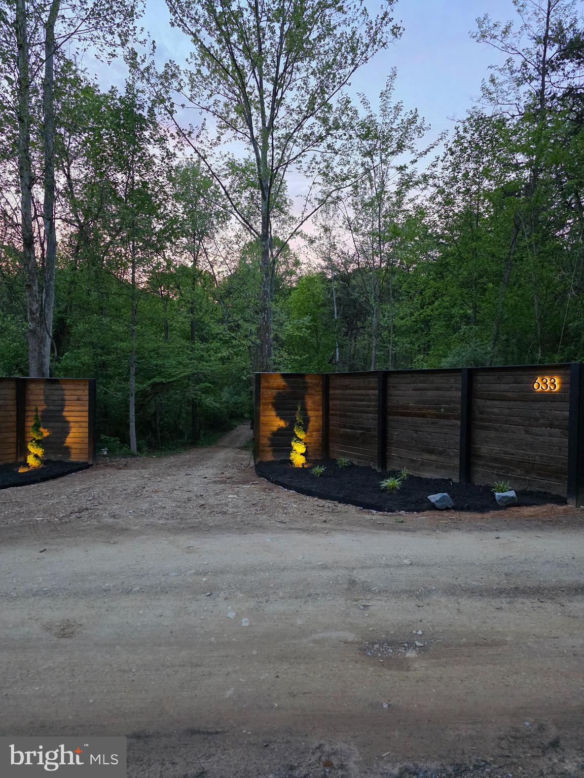 643 Hanging Rock Road Augusta, WV 26704 - Photo 19 of 22 entrance lights at evening time