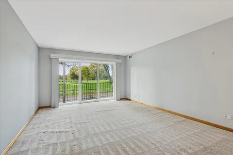 a view of an empty room with a balcony