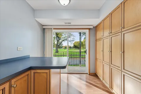 a view of a hallway with furniture and a gate