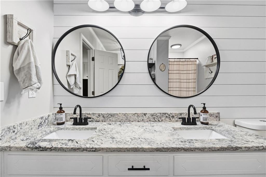 2777 Chickadee Drive Monroe, GA 30655 - Photo 13 of 36 a bathroom with a granite countertop sink and a mirror
