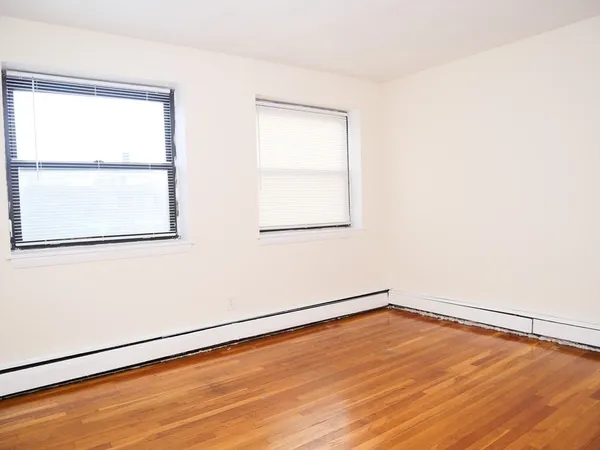 an empty room with a empty space and a window