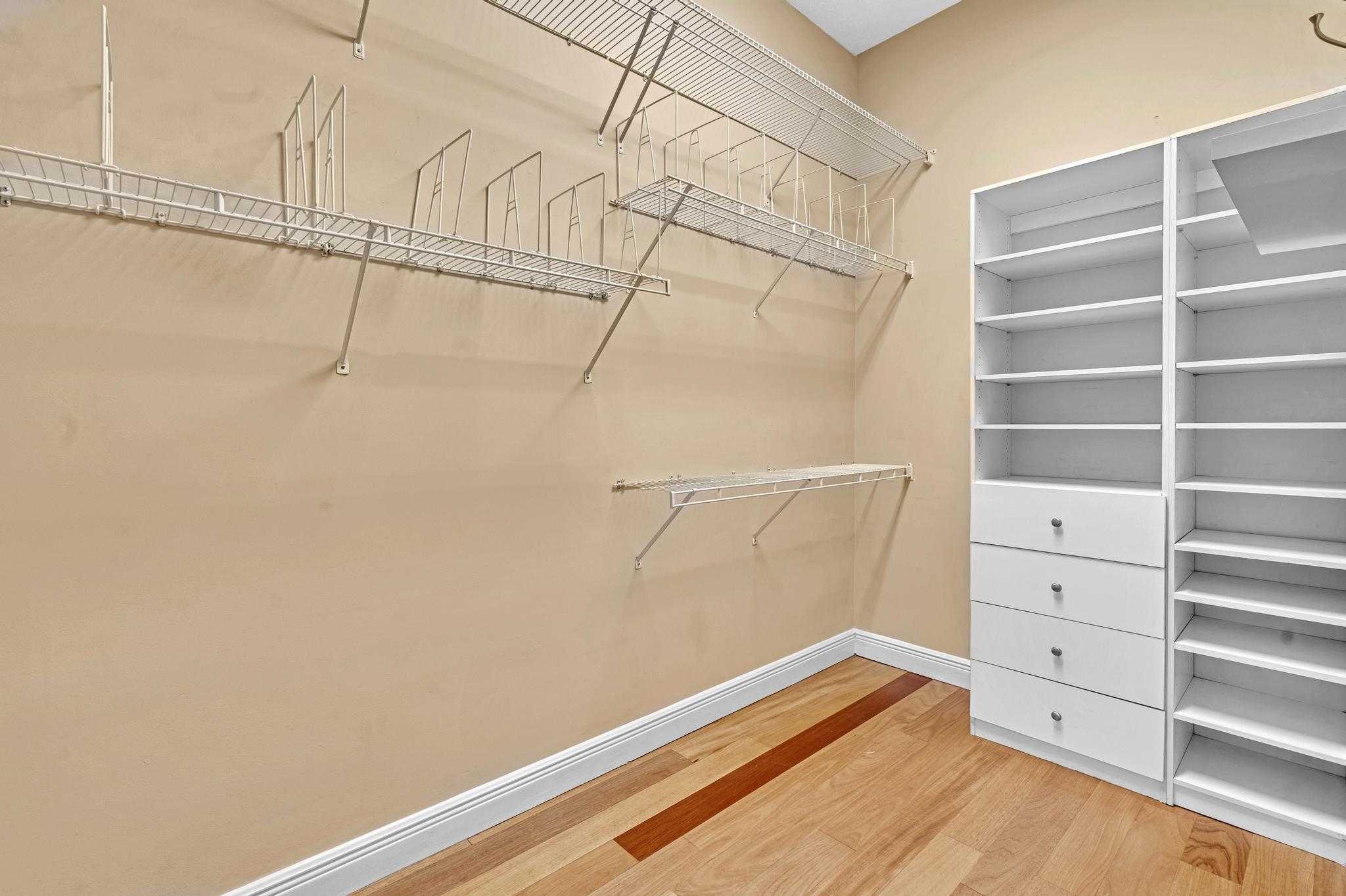 11604 Kensington Court Boca Raton, FL 33428 - Photo 33 of 81 a view of walk in closet with empty racks