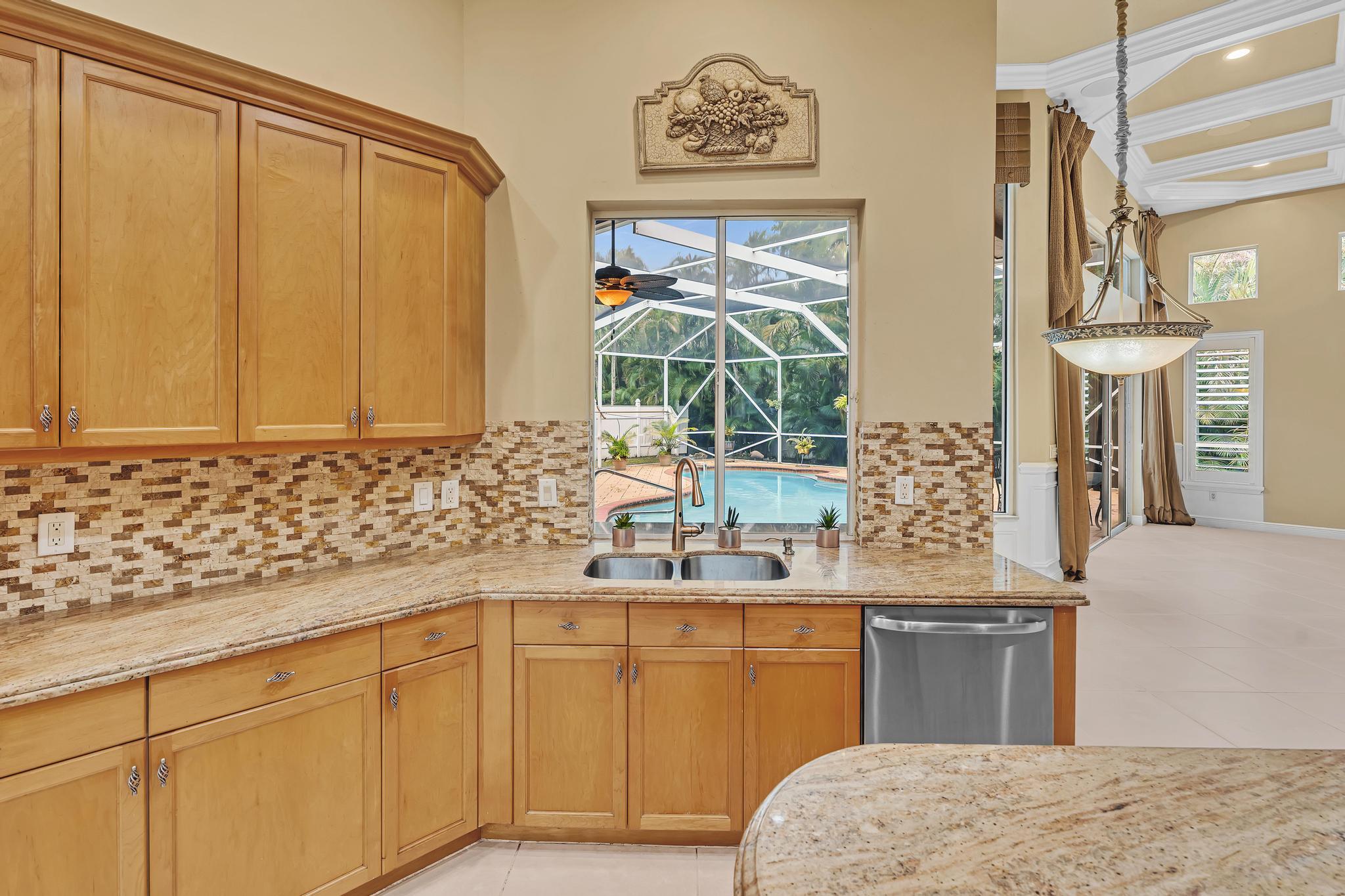 11604 Kensington Court Boca Raton, FL 33428 - Photo 43 of 81 a bathroom with a sink and a mirror