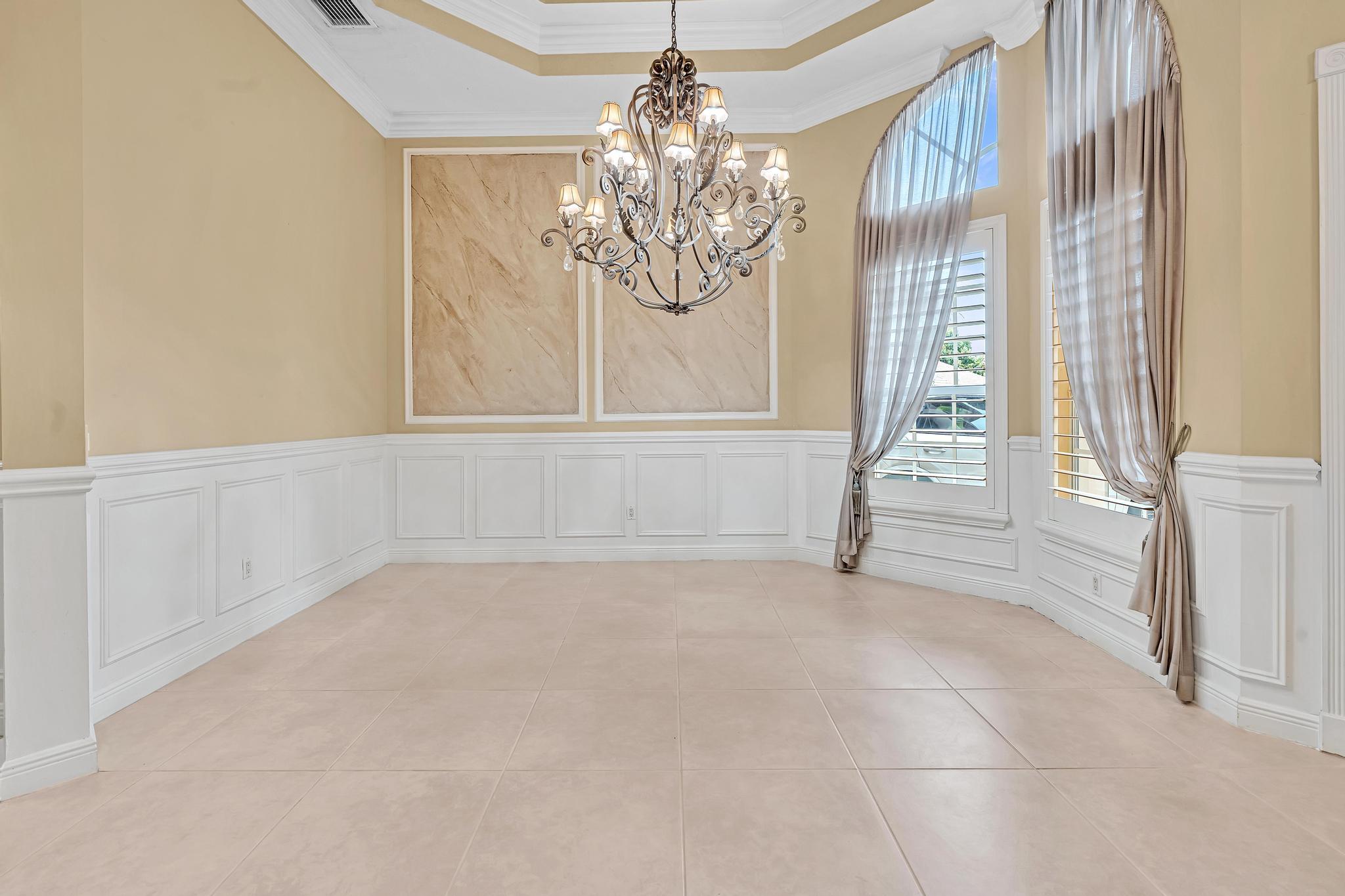 11604 Kensington Court Boca Raton, FL 33428 - Photo 10 of 81 a view of an empty room with a window