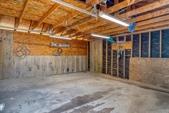 a view of a room with wooden walls