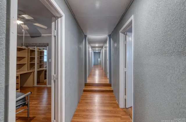 a view of gallery with wooden floor