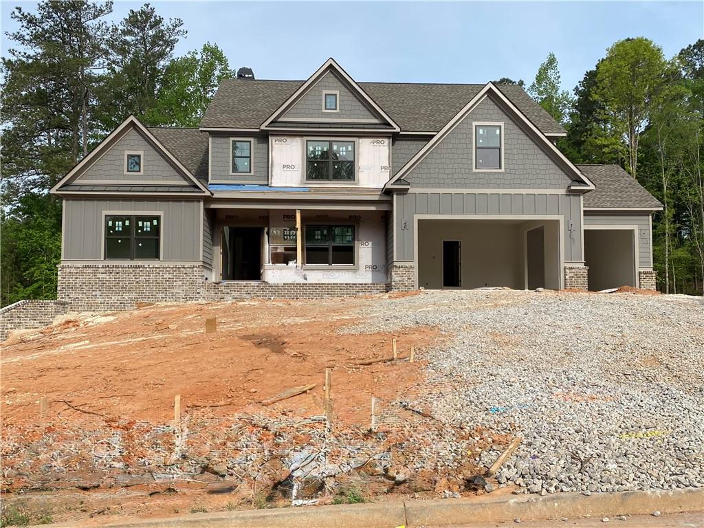 1425 Willowbend Place Monroe, GA 30655 - Photo 2 of 3 a front view of a house with a yard