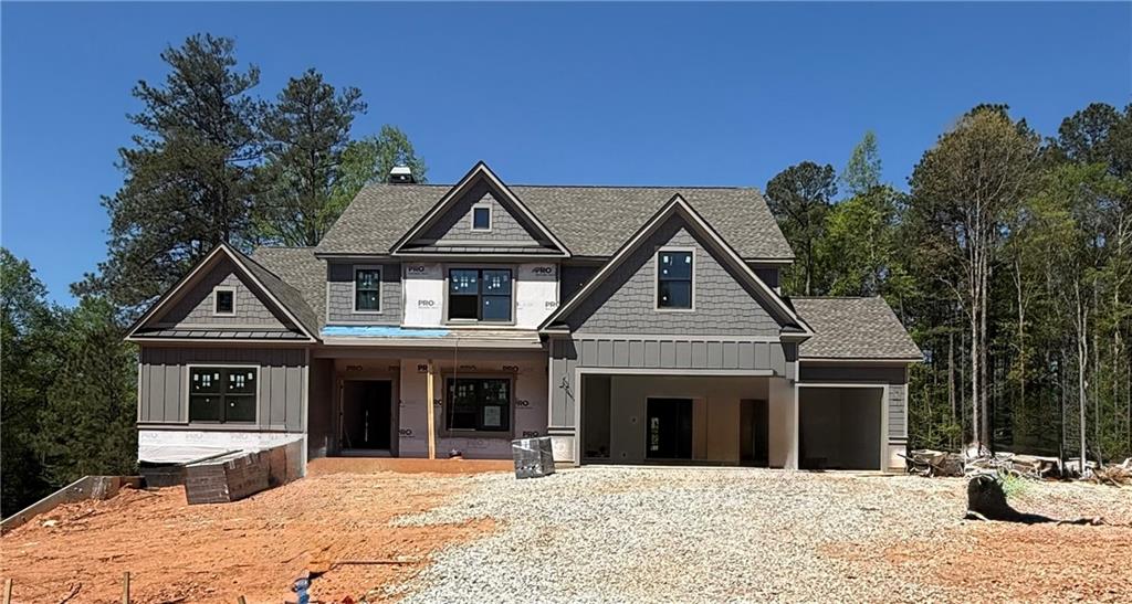 1425 Willowbend Place Monroe, GA 30655 - Photo 3 of 3 a front view of a house with a yard