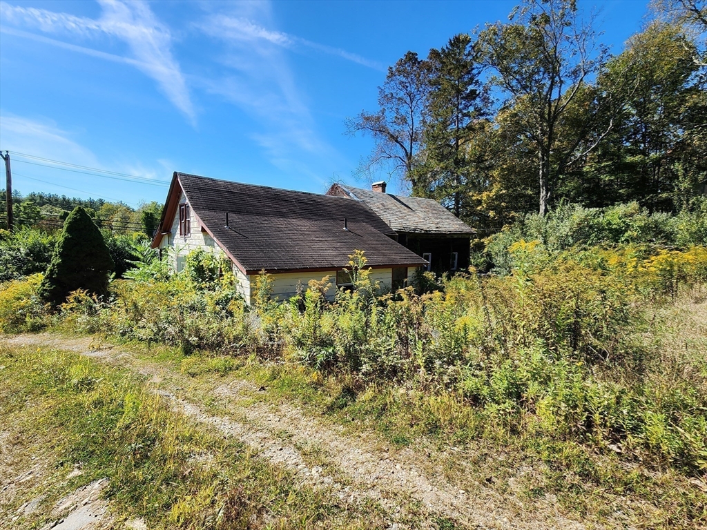 2155 Route 2 Charlemont, MA 01370 - Photo 11 of 26 a view of a garden with plants and large trees