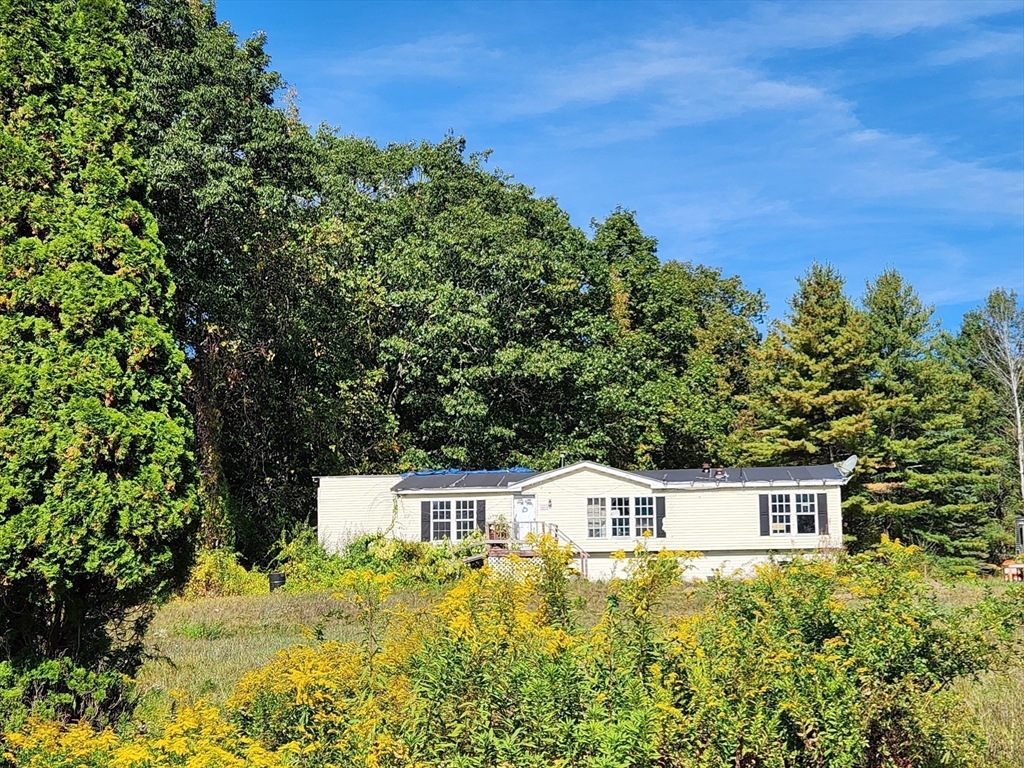 2155 Route 2 Charlemont, MA 01370 - Photo 2 of 26 a front view of a house with a yard