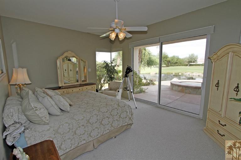 231 Loch Lomond Road Rancho Mirage, CA 92270 - Photo 13 of 25 a living room with furniture and a large window