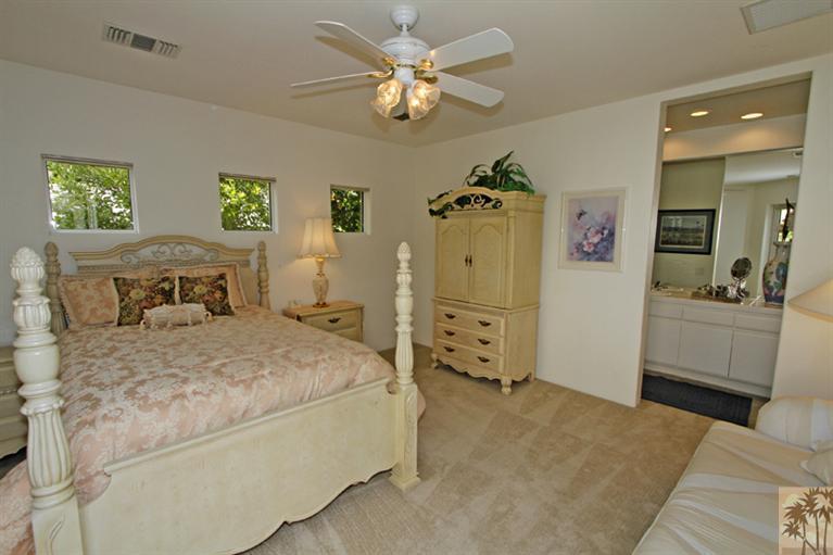 231 Loch Lomond Road Rancho Mirage, CA 92270 - Photo 16 of 25 a bedroom with a bed and dresser
