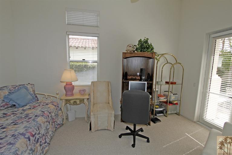 231 Loch Lomond Road Rancho Mirage, CA 92270 - Photo 19 of 25 a bed room with a bed and a chair