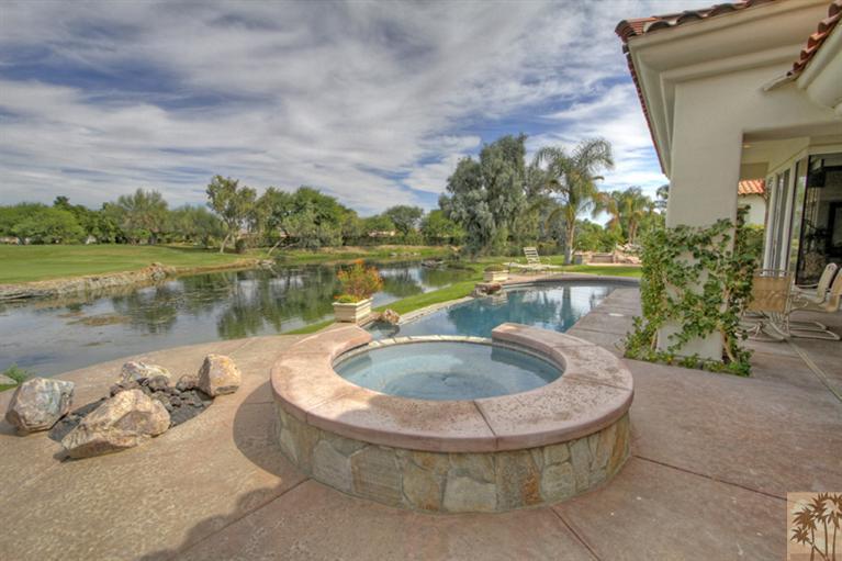 231 Loch Lomond Road Rancho Mirage, CA 92270 - Photo 2 of 25 a view of a lake in front of house