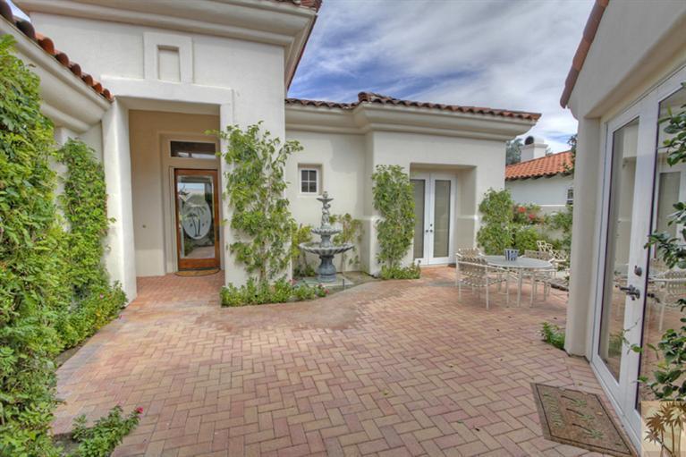 231 Loch Lomond Road Rancho Mirage, CA 92270 - Photo 5 of 25 a view of a house with potted plants