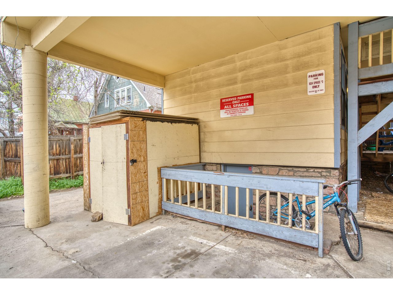 1034 Spruce Street Boulder, CO 80302 - Photo 13 of 17 a view of a wooden fence