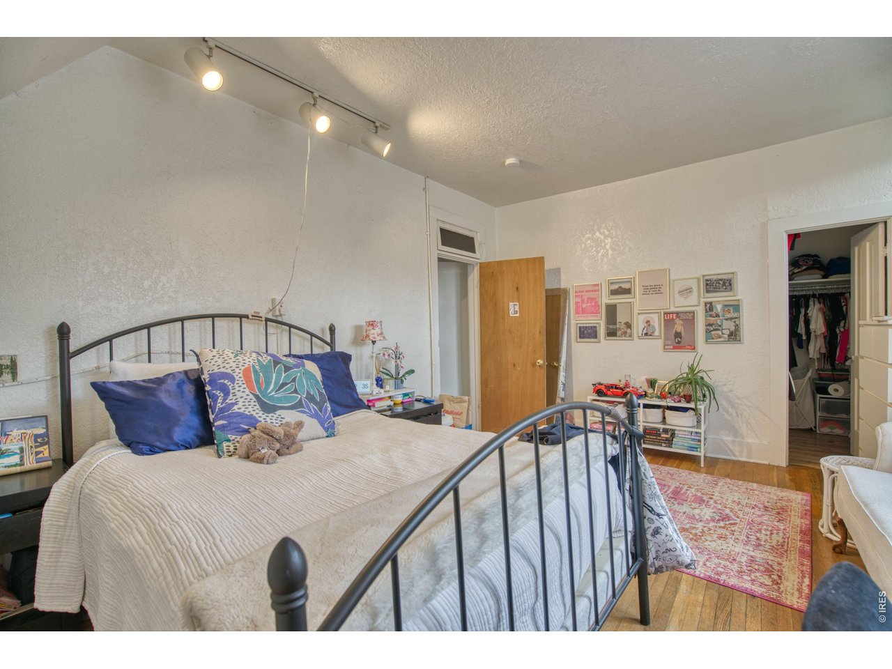 1034 Spruce Street Boulder, CO 80302 - Photo 4 of 17 a bedroom with a bed a table and chairs