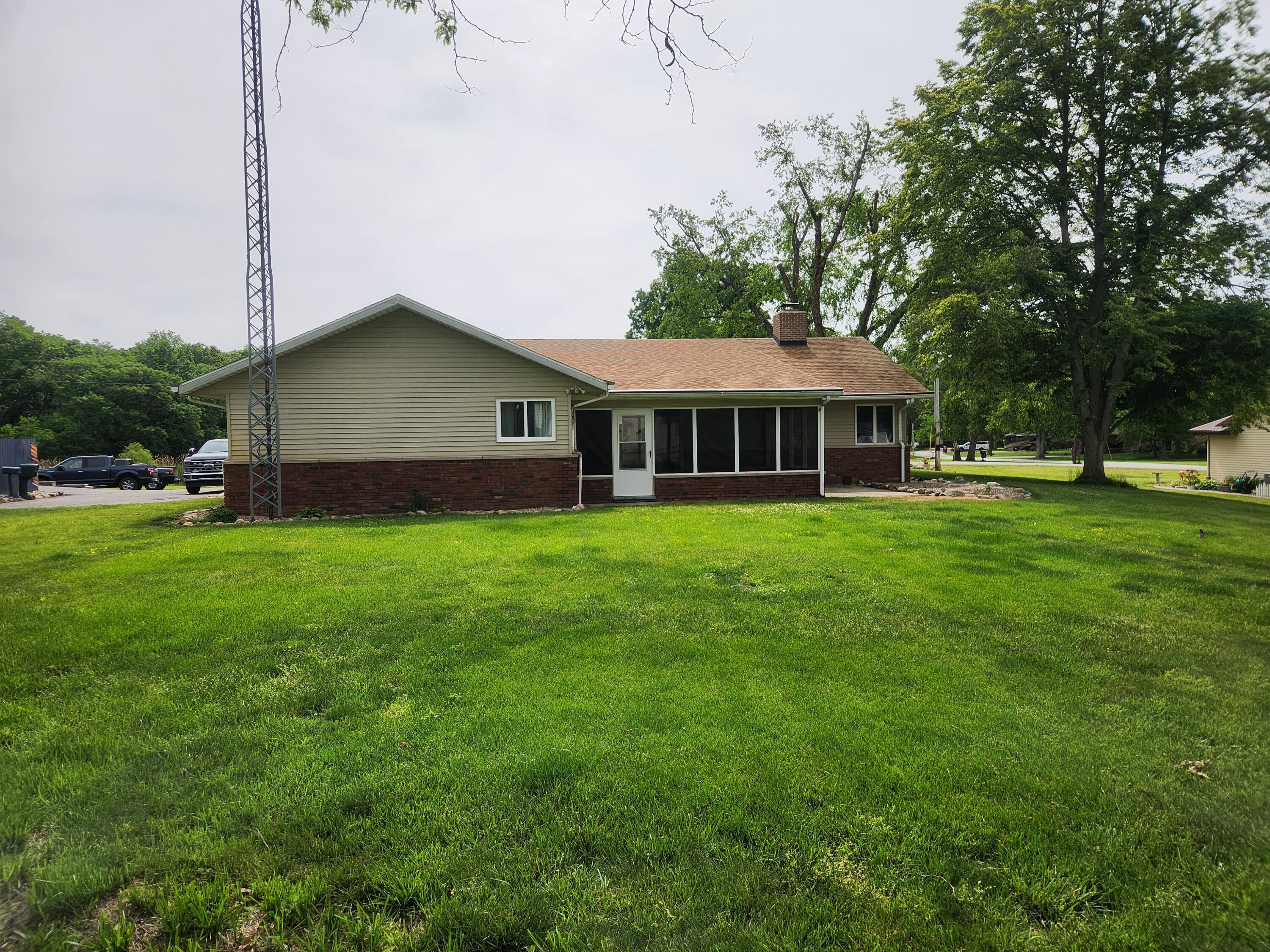 4726 Locksley Drive East Rensselaer, IN 47978 - Photo 3 of 33 a front view of a house with garden
