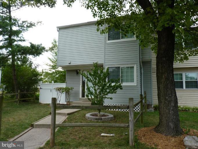 17420 Hughes Road Poolesville, MD 20837 - Photo 1 of 21 a front view of house with a garden