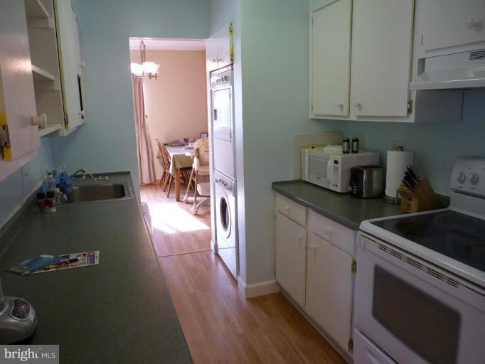 17420 Hughes Road Poolesville, MD 20837 - Photo 11 of 21 a kitchen with a sink and cabinets