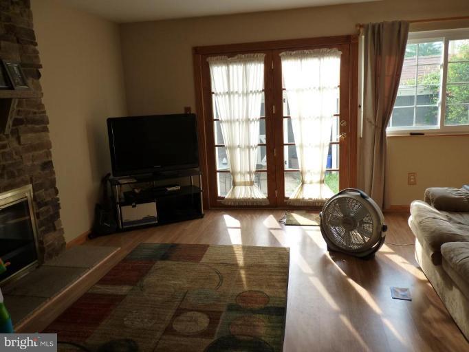 17420 Hughes Road Poolesville, MD 20837 - Photo 13 of 21 a living room with furniture and a flat screen tv