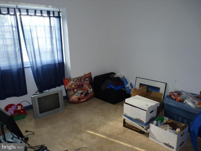 17420 Hughes Road Poolesville, MD 20837 - Photo 18 of 21 a bedroom with bed and a window