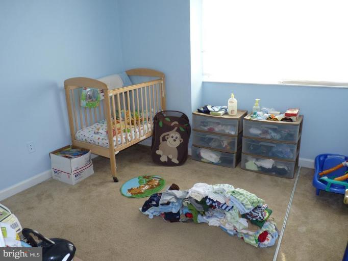 17420 Hughes Road Poolesville, MD 20837 - Photo 19 of 21 a bedroom with furniture and a window