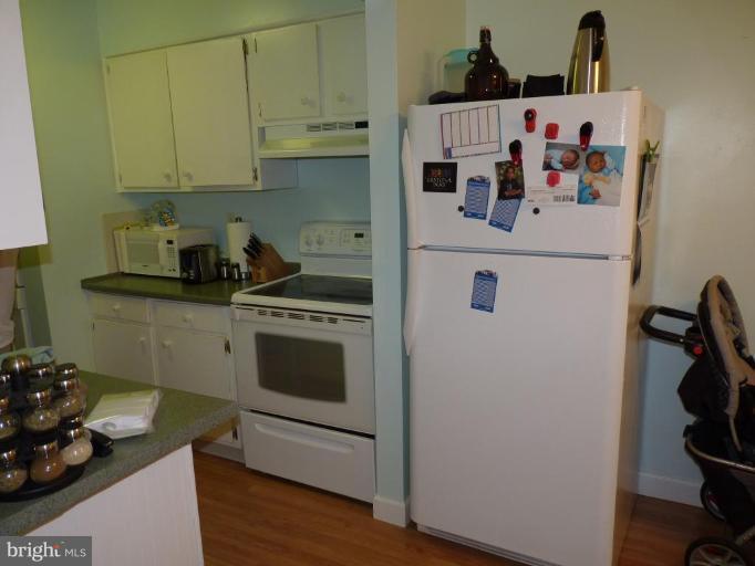 17420 Hughes Road Poolesville, MD 20837 - Photo 7 of 21 a white refrigerator freezer sitting inside of a kitchen