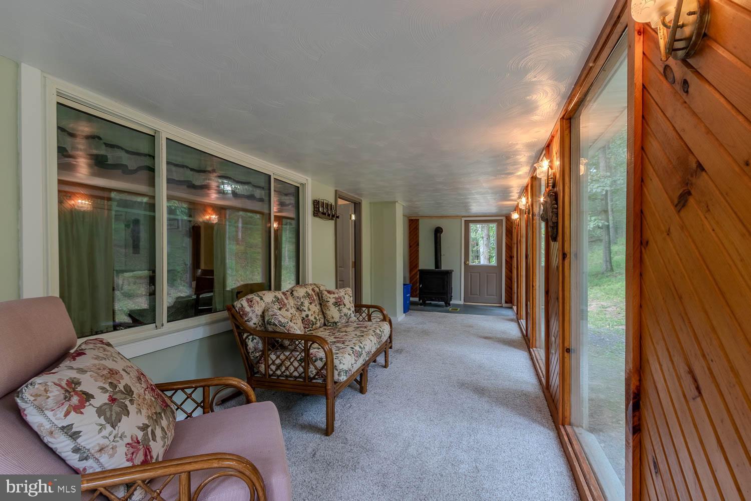 14742 Happy Hills Road Huntingdon, PA 16652 - Photo 25 of 48 a outdoor space with patio the couches and potted plants