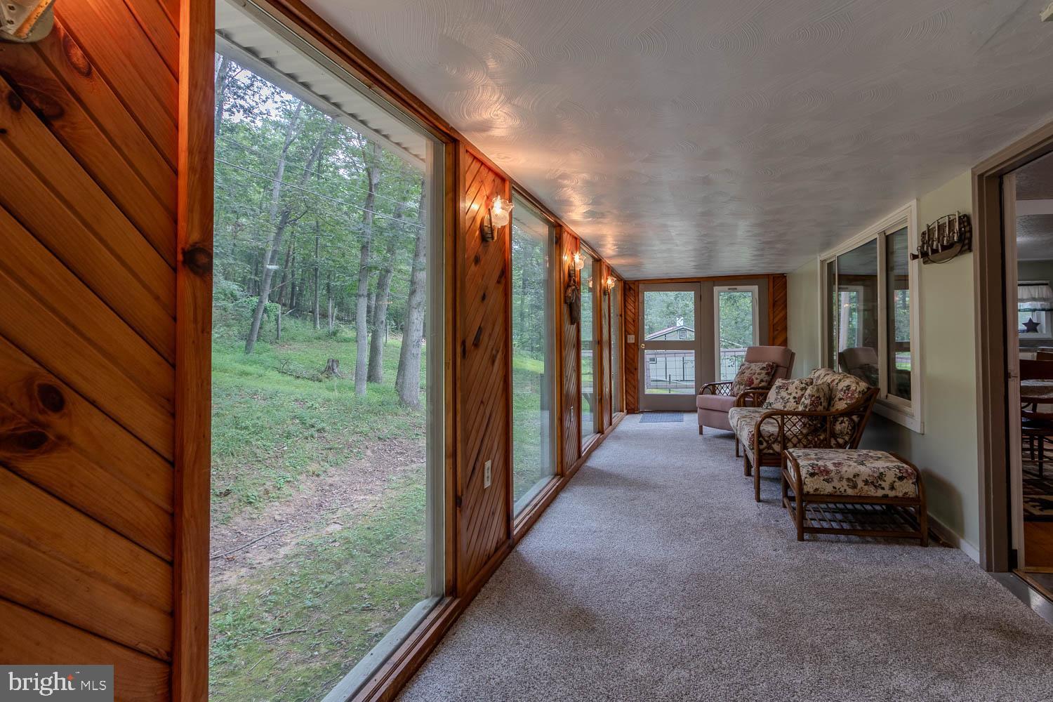 14742 Happy Hills Road Huntingdon, PA 16652 - Photo 26 of 48 a view of living room with furniture and floor to ceiling window