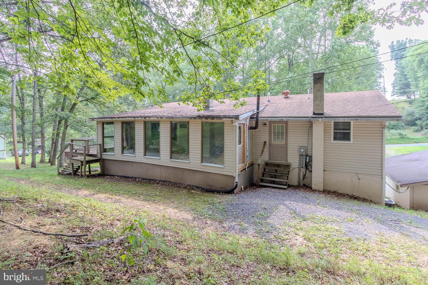 14742 Happy Hills Road Huntingdon, PA 16652 - Photo 30 of 48 a view of a house with a garden