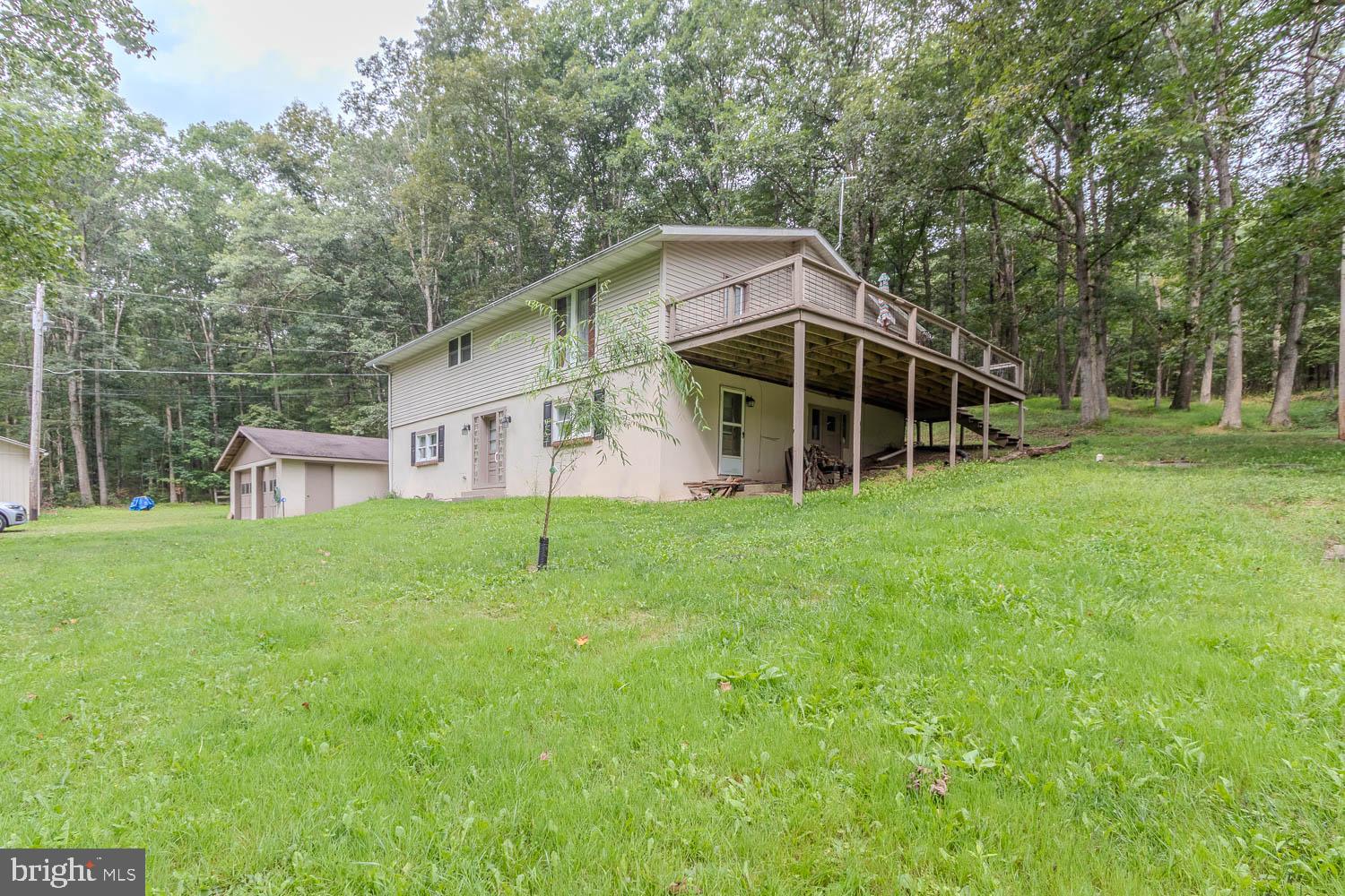14742 Happy Hills Road Huntingdon, PA 16652 - Photo 32 of 48 a view of a house with backyard and garden