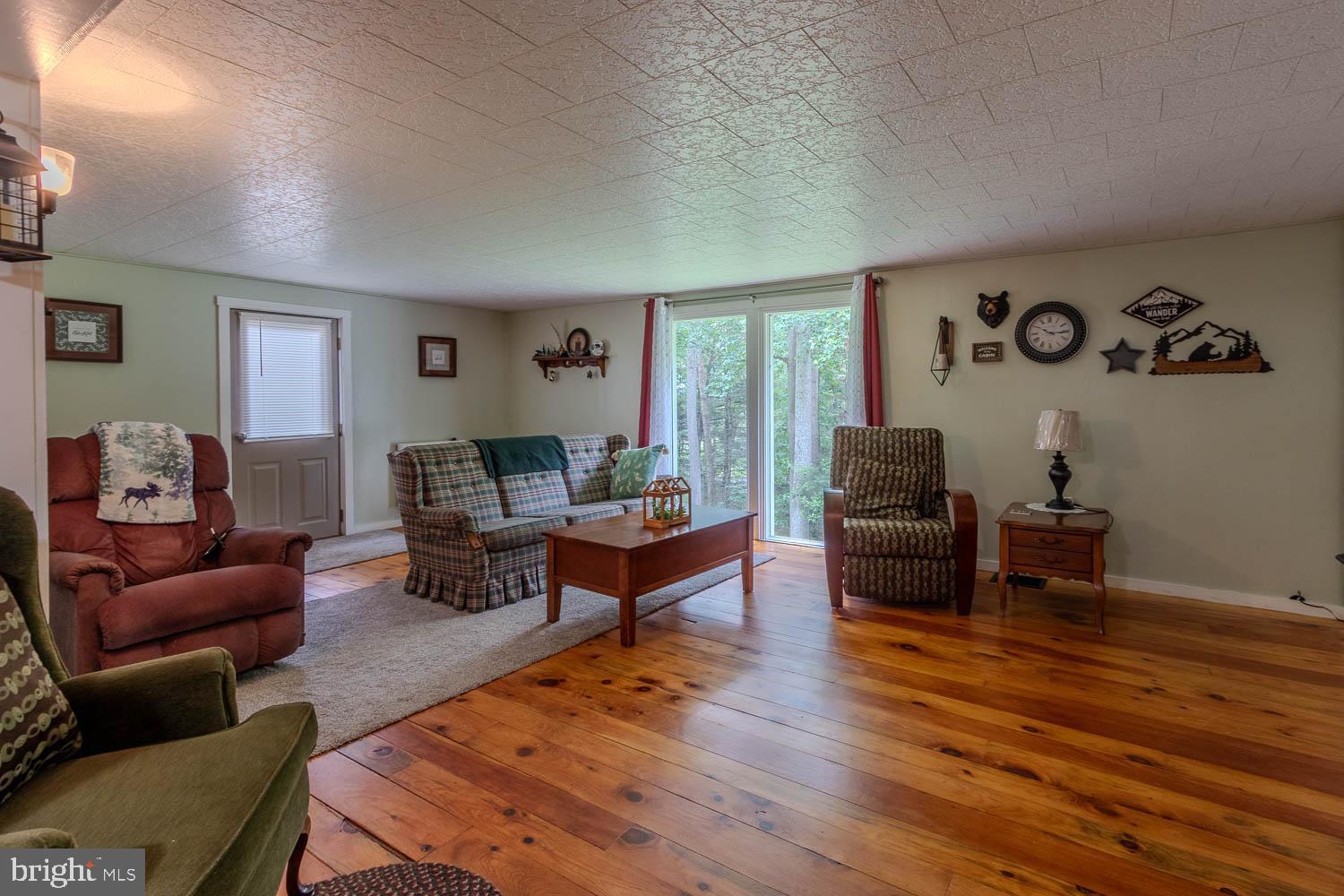 14742 Happy Hills Road Huntingdon, PA 16652 - Photo 4 of 48 a living room with furniture and wooden floor