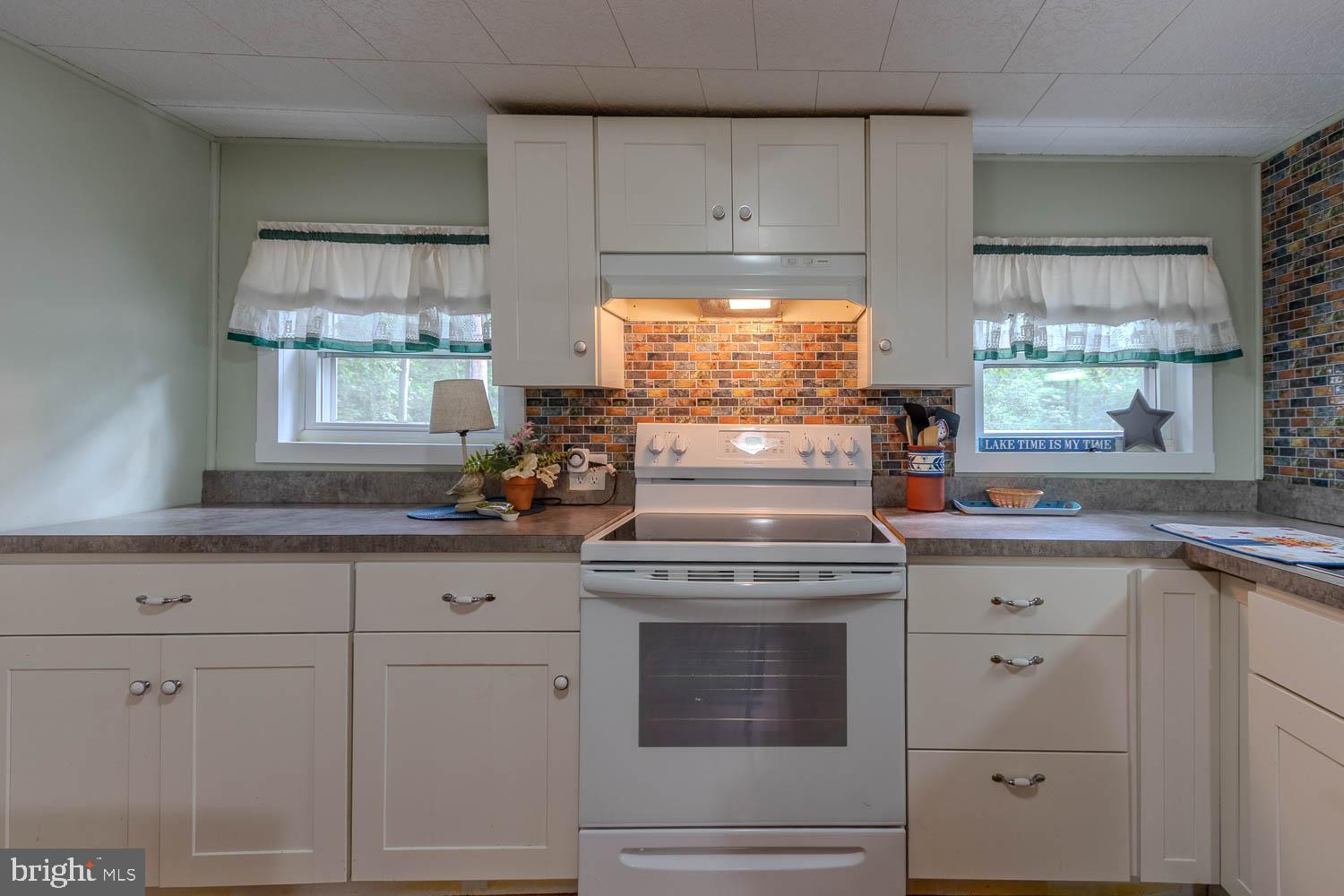 14742 Happy Hills Road Huntingdon, PA 16652 - Photo 8 of 48 a stove top oven sitting inside of a kitchen