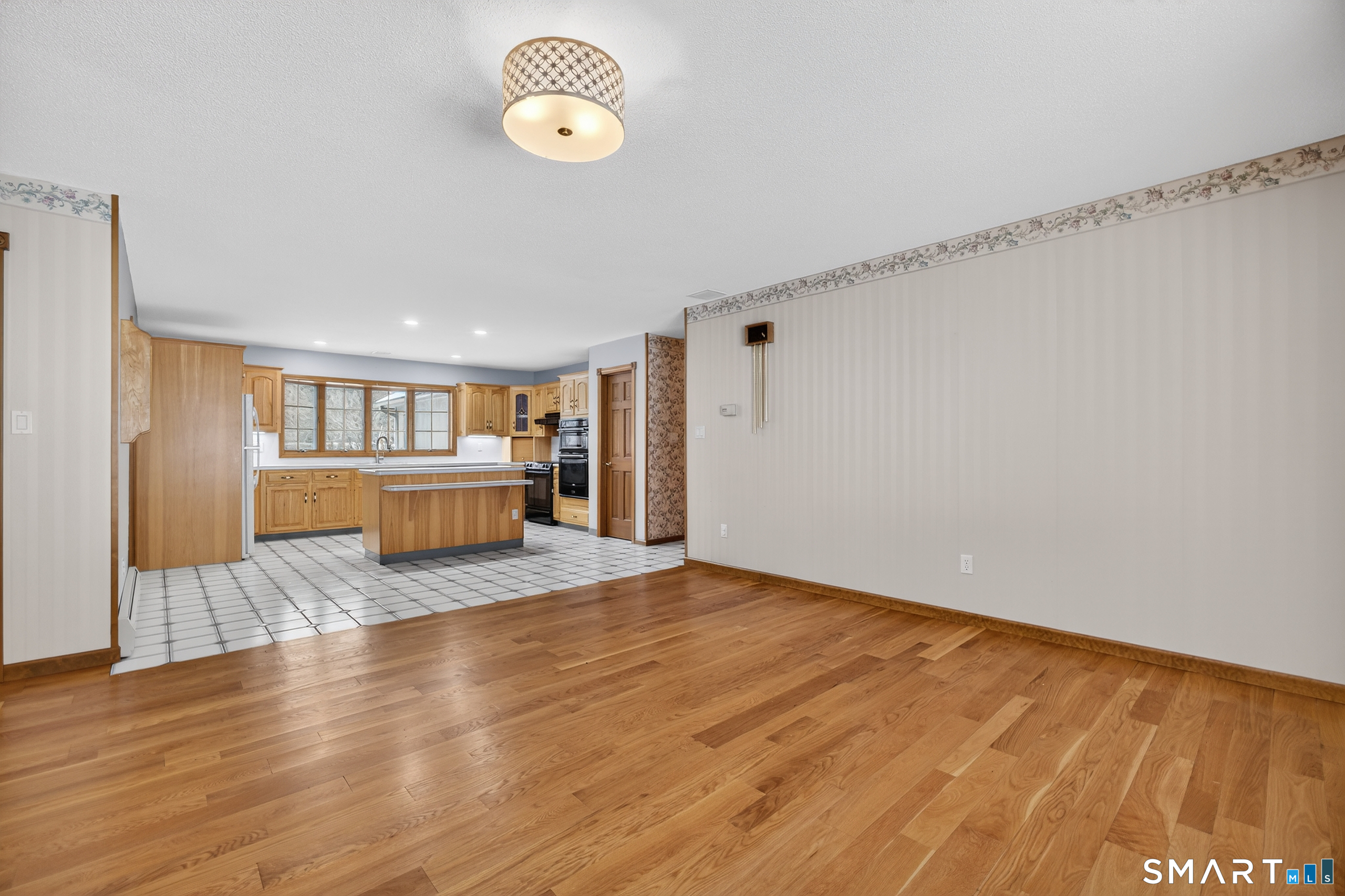 61 Edwards Road Bethany, CT 06524 - Photo 11 of 40 a view of a room with wooden floor and window