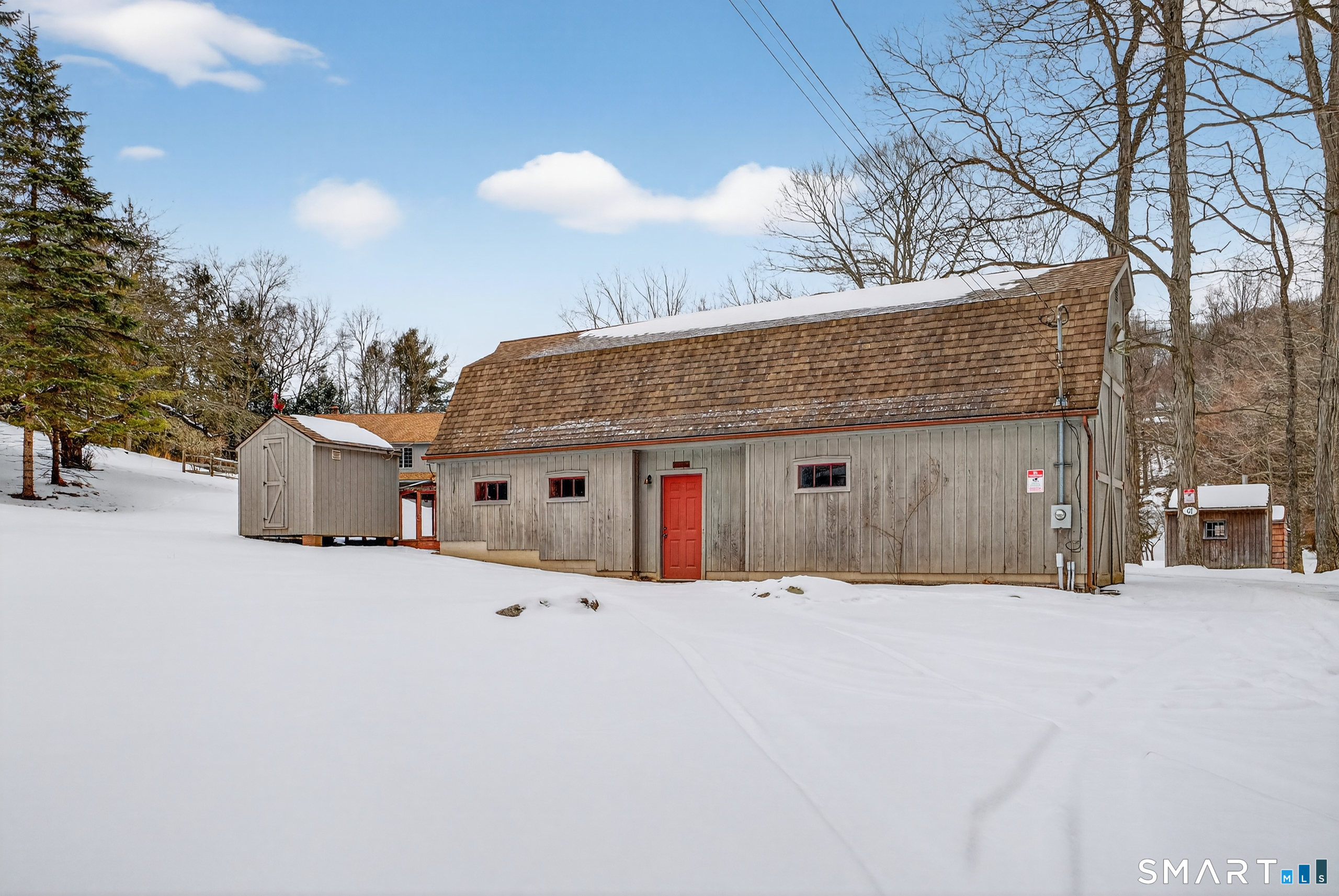 61 Edwards Road Bethany, CT 06524 - Photo 17 of 40 a front view of a house with a yard covered in snow