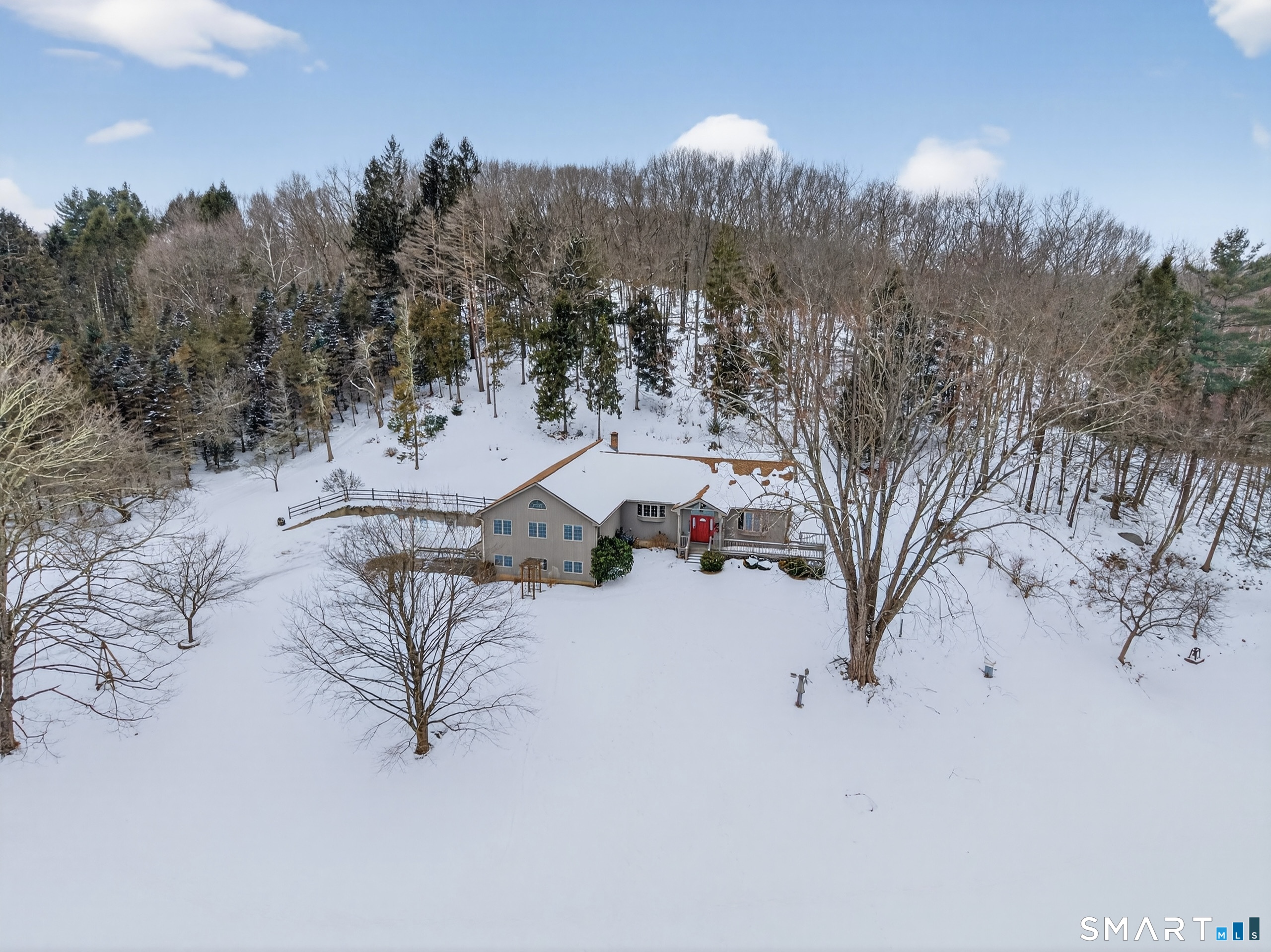 61 Edwards Road Bethany, CT 06524 - Photo 2 of 40 a view of a large space covered with snow in the background