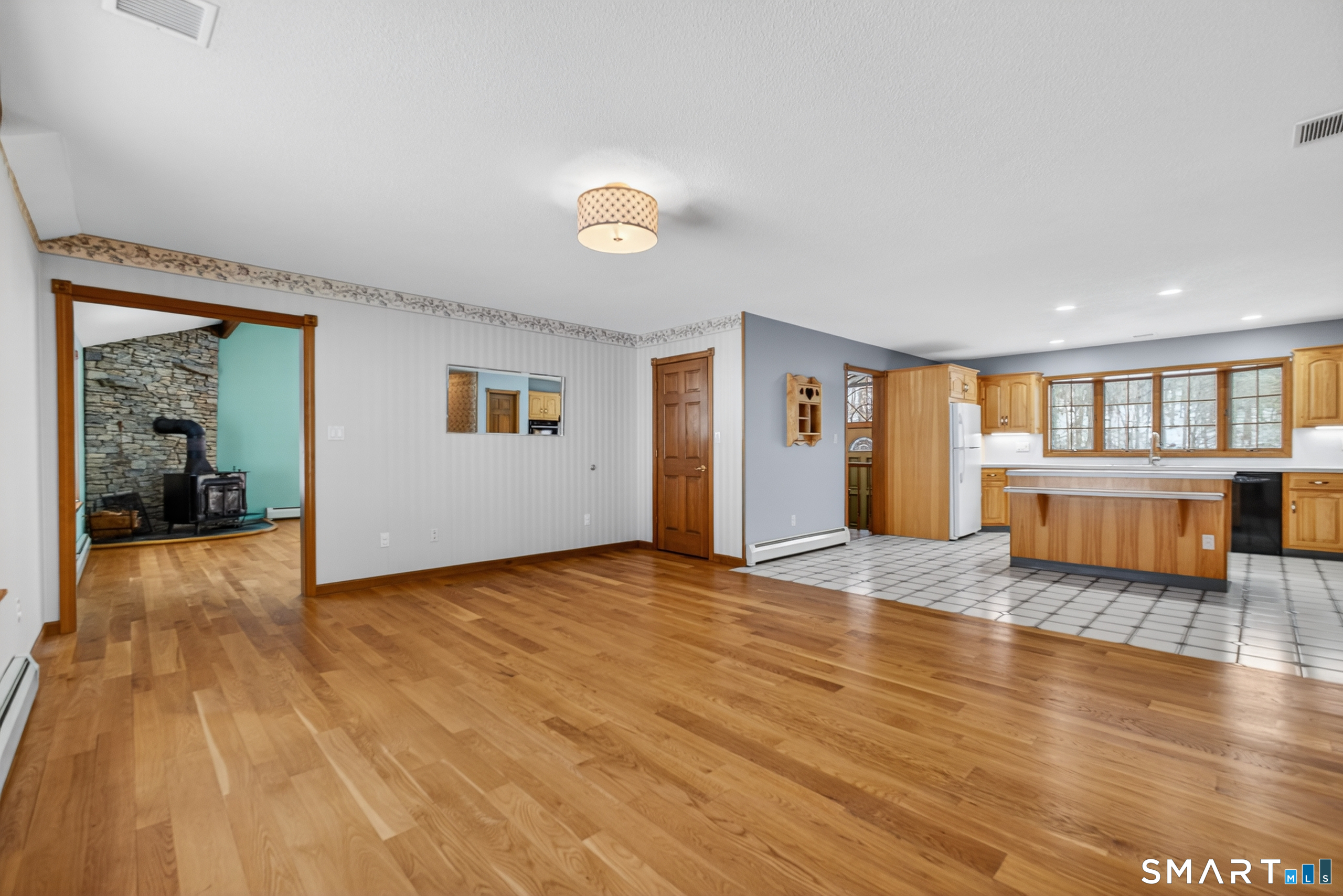 61 Edwards Road Bethany, CT 06524 - Photo 29 of 40 a view of a livingroom with wooden floor and furniture