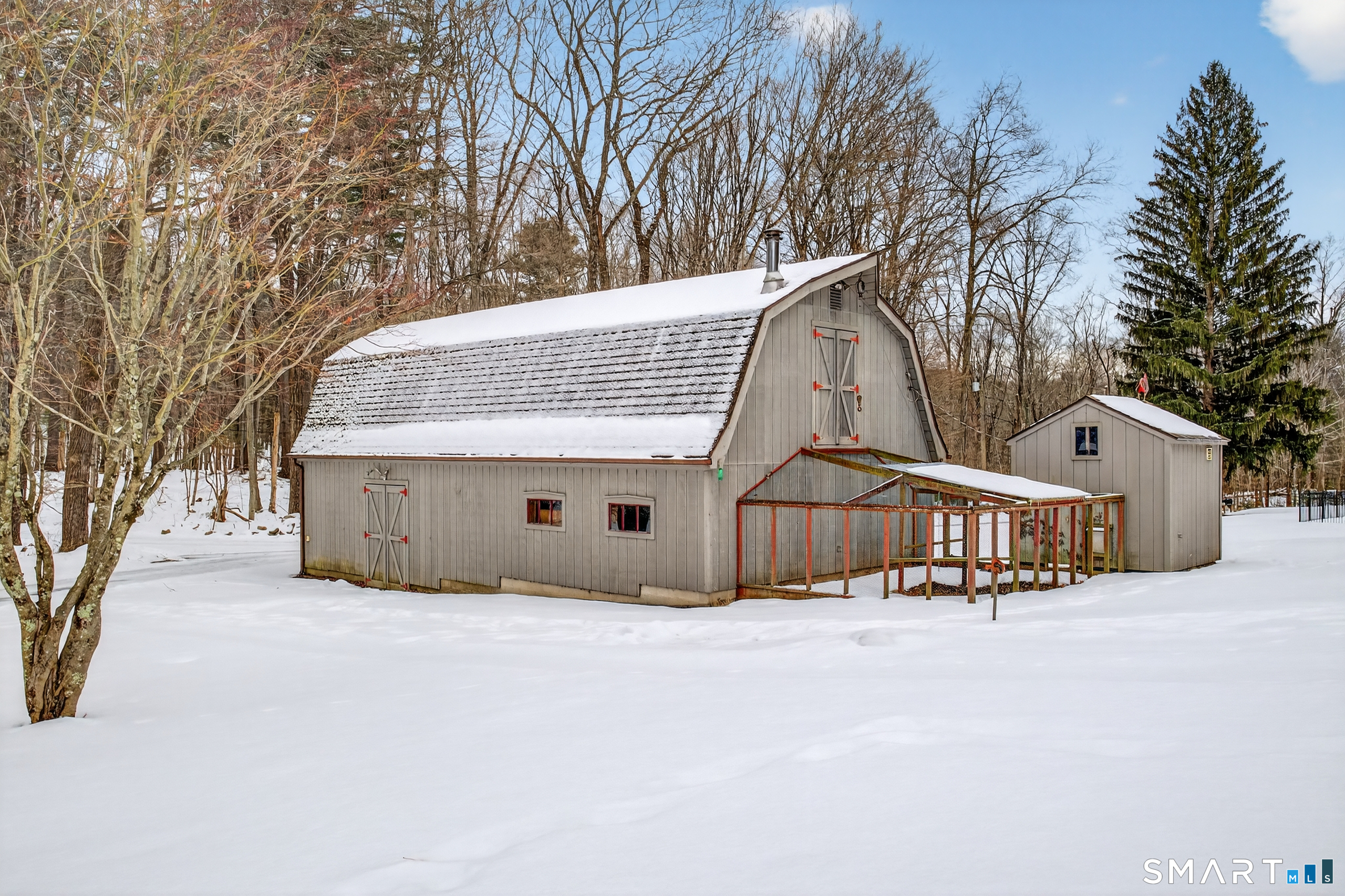 61 Edwards Road Bethany, CT 06524 - Photo 39 of 40 a view of a house with a yard covered in snow