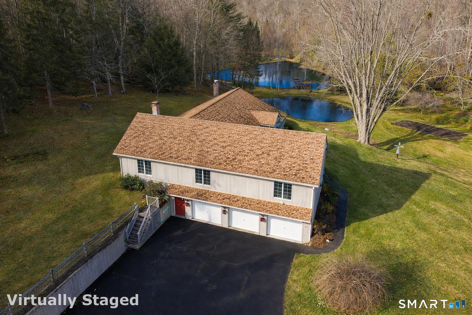 61 Edwards Road Bethany, CT 06524 - Photo 4 of 40 a view of a house with a yard