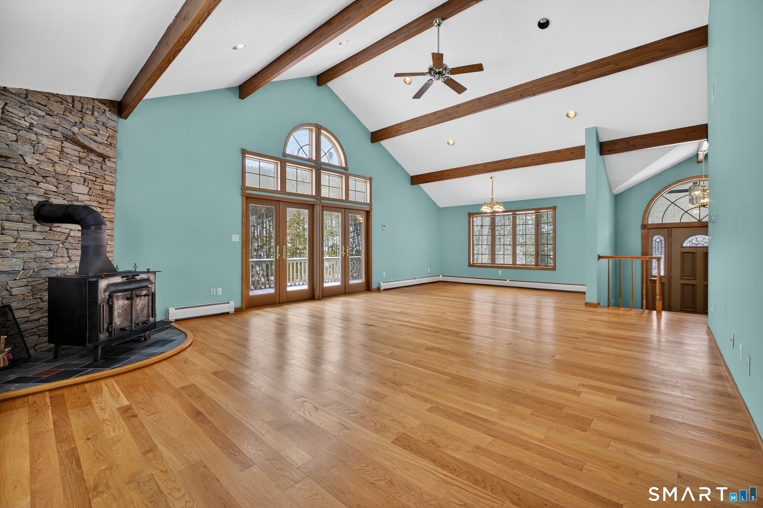 61 Edwards Road Bethany, CT 06524 - Photo 5 of 40 a view of an empty room with wooden floor and a window