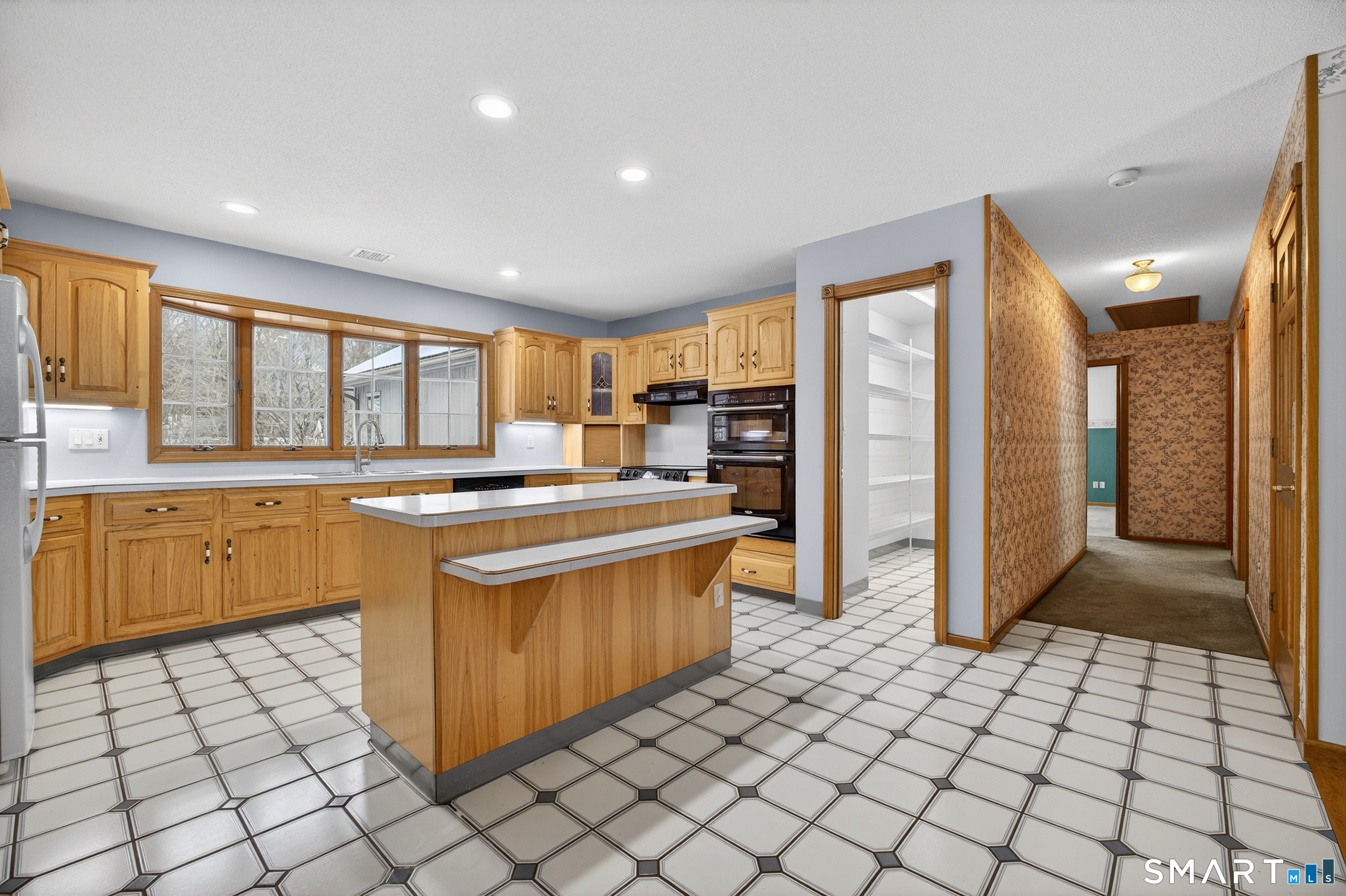 61 Edwards Road Bethany, CT 06524 - Photo 9 of 40 a kitchen with stainless steel appliances granite countertop a refrigerator and a sink