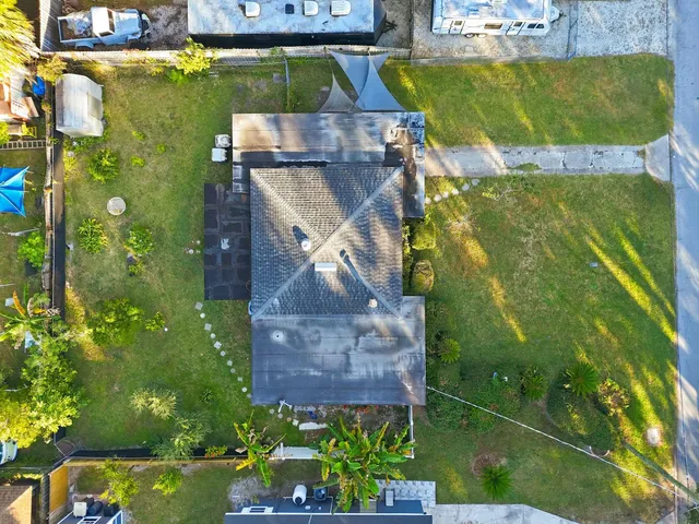 an aerial view of a house with a garden
