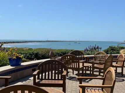 a view of a balcony with an outdoor seating