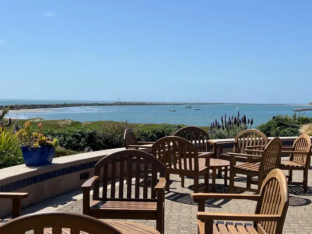 a view of a balcony with an outdoor seating